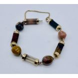 A hardstone bracelet with gold (tested) mounts- missing clasp