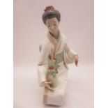 A large Nao figure of kneeling Geisha flower arranging, numbered 1276 height 35cm