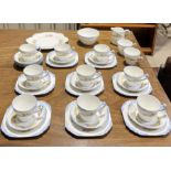 A Heathcote China part tea set in "The Downs" pattern with floral design, includes 8 trios, sugar