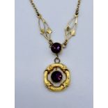 A 9ct gold pendant on chain set with amethysts