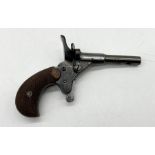 A .22 dog scaring/starter pistol with wooden handle