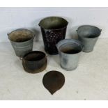 A collection of four vintage galvanised buckets, along with small cast iron cauldron etc