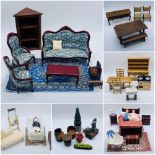 A collection of dolls house furniture including tables, chairs, dresser, picnic table, sink, three