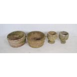 A pair of reconstituted stone garden pots along with a pair of reconstituted stone garden urns (