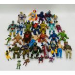A collection of vintage toy figurines including Thundercats, He-Man, The A Team, Beetlejuice etc