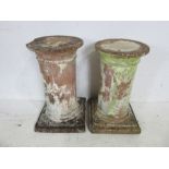 A pair of well weathered terracotta columns, 54cm height