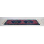 A Tunisian blue ground wool runner - 258cm x 77cm