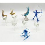 A collection of glass animals and figures including Murano fish, archer, skier, pair of antelope