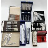 A large collection of boxed silver plated cutlery, teapots, serving dishes etc.