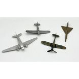 A collection of four model planes including two cast aluminium, brass etc.