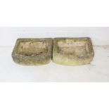A pair of stone planters. Approx measurements 47cm x 32cm height 15cm.