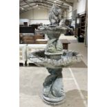 A Henri Studio two tier composite stone fountain with stylised dolphin design in five sections -