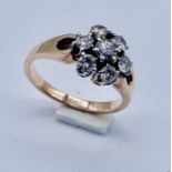 A 14ct gold daisy ring set with diamonds-approx. 1/2 carat total diamond weight (2 claws damaged)