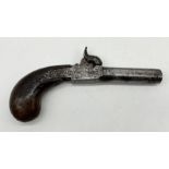 A 19th century percussion pistol with concealed trigger, engraved decoration and wooden handle -