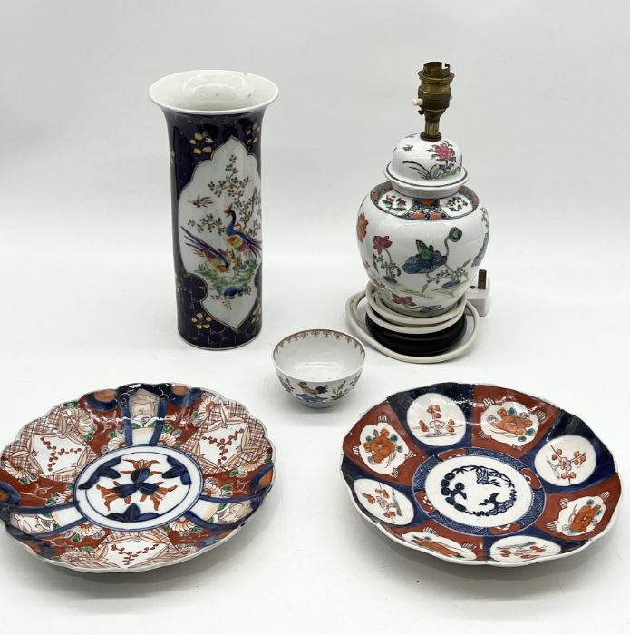 A collection of Oriental china including cylindrical Chinese vase, two Imari plates, lamp etc.