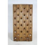 A French oak folding wine/champagne rack, marked 'Ste Leban, fabricant Epernay - France' - length