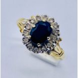 A sapphire and diamond cluster ring set in 18ct gold