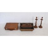 A pair of barley twist candlesticks along with a small vintage suitcase and a cutlery tray