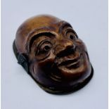 A novelty carved wooden turn of the century letter/paper clip in the form of a mans head