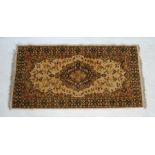 An Israeli Salome beige ground 'Samaria' pattern rug by Camel Carpets - 140cm x 70cm