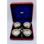 A cased set of hallmarked silver salts with spoons retailed by Tilley & Son, Dorchester