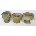 Three weathered reconstituted stone garden planters.