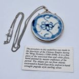 A 925 silver pendant set with a shard of Ming dynasty pottery (5.25cm diameter) on 925 silver chain