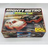 A boxed Mighty Metro Scalextric set including two cars, two controllers, power pack and track.