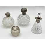 Two antique silver topped cut glass scent bottles, a silver rimmed match striker and a SCM atomiser