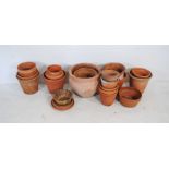 A quantity of terracotta garden pots