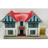 A vintage wooden dolls house