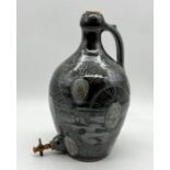A David Eeles studio pottery wine flagon with cork tap (A/F) - Height 35cm