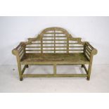 A weathered wooden Lutyens style garden bench - length 166cm, depth 58cm, height 105cm