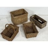 A collection of wicker baskets along with a vintage wooden Schweppes crate