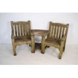 A weathered wooden garden loveseat with central table, marked 'Woodfurn' - length 184cm
