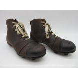 A pair of vintage leather football boots circa 1940