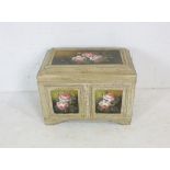 A crackle glaze painted trunk with floral decoration. 70cm x 43cm, height 55cm