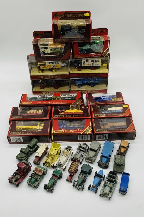 A collection of boxed Matchbox Models of Yesteryear die-cast vehicles, along a collection of loose