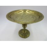 A brass tazza decorated with roundels of religious scenes, height 20cm
