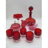 A collection of cranberry and ruby glass