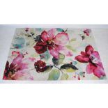 A 'Paco Home' modern white ground rug with floral decoration - 160cm x 230cm