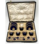 A cased Royal Worcester cobalt blue and gilt highlighted coffee set comprising five cups and six