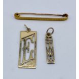 Two 9ct gold pendants along with a 9ct stock/tie clip, total weight 5.7g