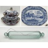 A Victorian glass rolling pin along with a large antique blue and white meat platter and a Victorian