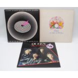 A collection of three Queen vinyl records, comprising 'Jazz' with original inner sleeve and fold out