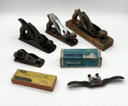 A collection of vintage Stanley and Record planes including a Stanley No. 37 smoothing plane,