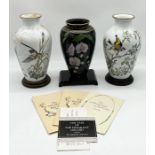 A pair of Franklin Mint porcelain vases with stands, comprising The Meadowland Bird vase and The