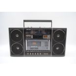 A Panasonic Ambience Stereo RX-F32L radio and cassette player, with cable