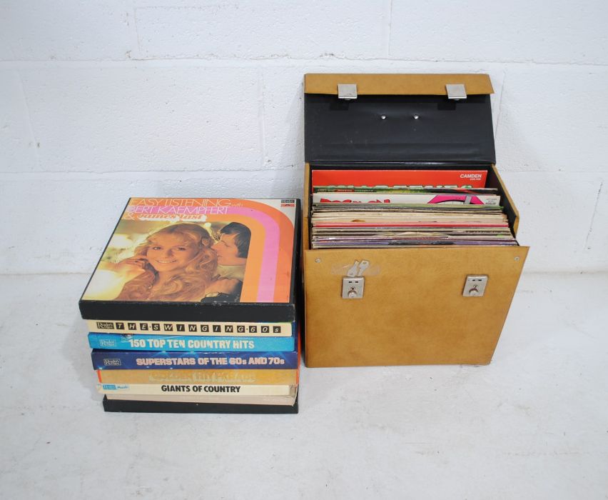 A quantity of 12" vinyl records, including Bob Marley and The Wailers, Chuck Berry, Bill Haley,