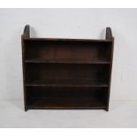 A stained pine freestanding bookcase - length 91cm, depth 27cm, height 92cm